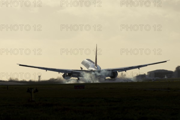 Boeing 777 A7-BFL commercial jet aircraft of Qatar cargo in flight landing on the runway at London