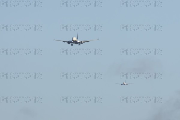 Boeing 737 two commercial passenger airliner jet aircraft of Ryanair airways in flight on approach
