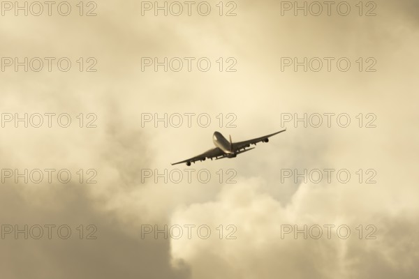Boeing 747-400 jumbo jet LX-TCV commercial aircraft of Cargolux cargo in flight silhouette at