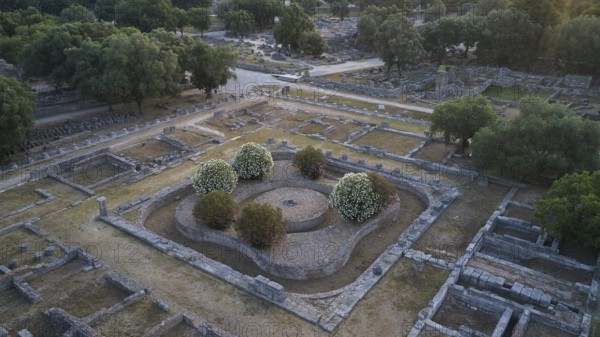 Leonidaion, complex with ruins and symmetrical stone structures surrounded by green vegetation,