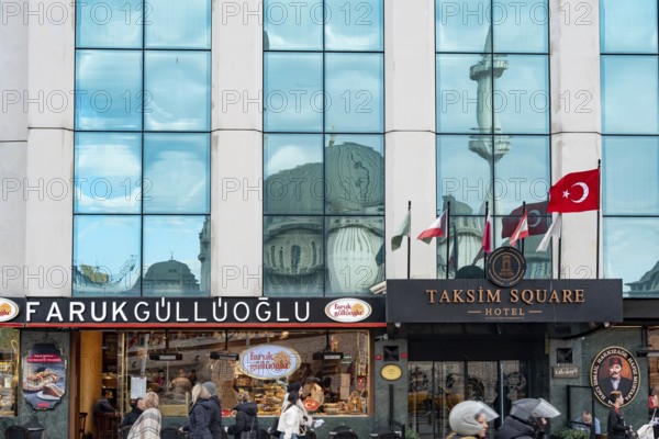 Istanbul, Turkey. January 3rd 2025. Farukgulluoglu Sweet shop and the Taksim Square Hotel at the