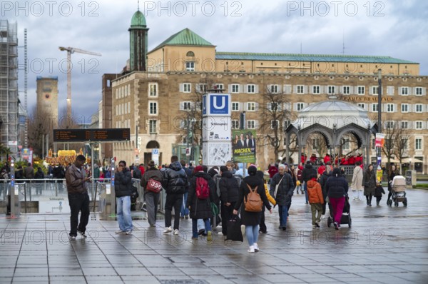 People stroll on Konigsstraße, Schlossplatz, Pavilion, Old Station Tower, Bonatzbau, Subway