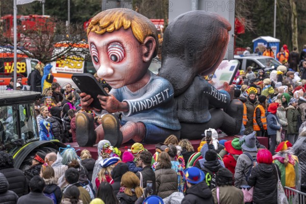 Rose Monday procession in Düsseldorf, theme car by wagon manufacturer Jacques Tilly, topic of