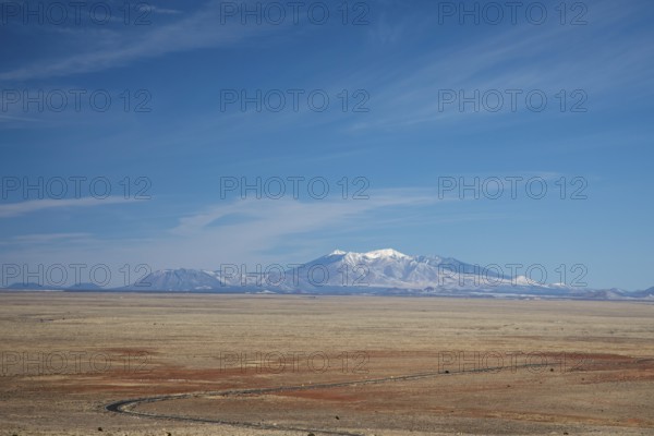 Winslow, Arizona - The San Francisco Peaks, seen from the Meteor Crater, about 45 miles distant.