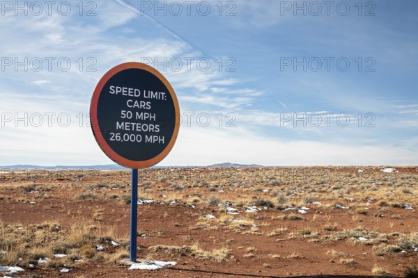 Winslow, Arizona - A speed limit sign on the road to Meteor Crater. The crater was formed about 50,