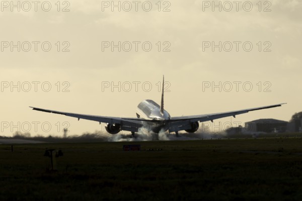 Boeing 777 A7-BFL commercial jet aircraft of Qatar cargo in flight landing on the runway at London