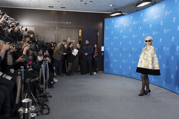Pamela Anderson (actress) in front of photographers at a photocall for the film Rosebush Pruning at