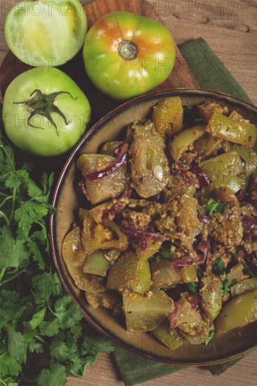Fried green tomatoes, with onions and spices, green tomato appetizer, Georgian cuisine, homemade,