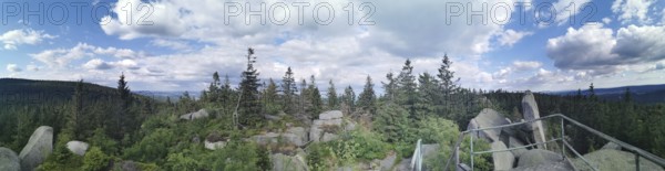 Panorama from Nusshardt over wooded area with views of rocks and sky, Franconian mountain trail,