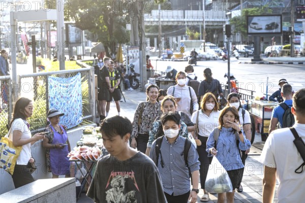 Bangkok, Thailand. March 25th 2025. Thai commuters enter and exit the Lumpini Metro station in the
