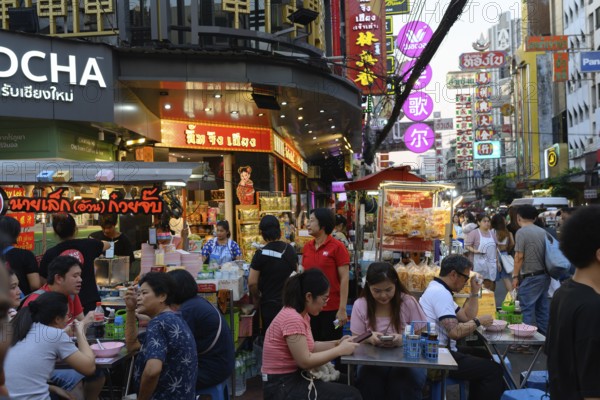 Bangkok, Thailand. February 18th 2025. Busy evening crowds at popular street food stalls along