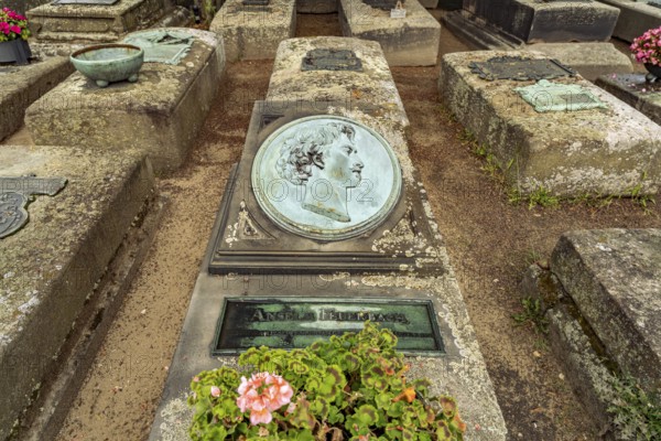 Grave of painter Anselm Feuerbach at the medieval St. John's Cemetery and St. John's Church in