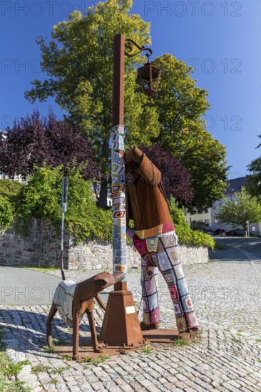 Iron Giants sculpture Territorios or drunk with dog by Edgardo Camona on the old market in