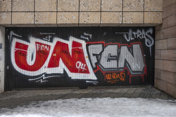 Illegal graffiti of the Nuremberger 1st FCN of the Ultras at an emergency exit, Nuremberg, Middle
