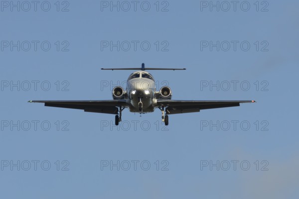 Cessna Citation small executive business jet aircraft in flight on approach to land at London