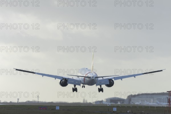 Boeing 777 commercial passenger airliner jet aircraft of Emirates airways landing on the runway at