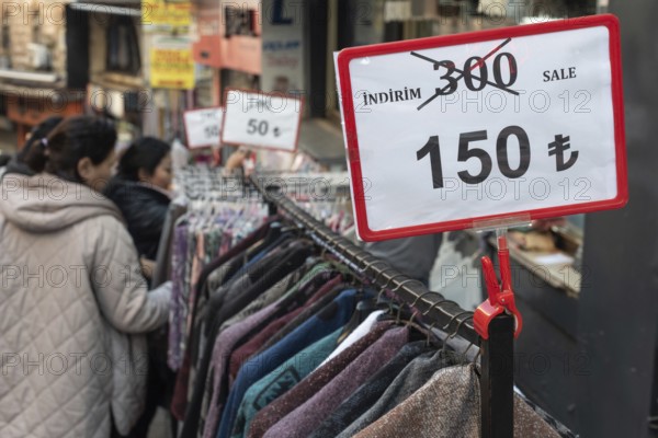 Istanbul, Turkey 7th January 2025. Local shoppers browsing clothes reduced in price in a popular