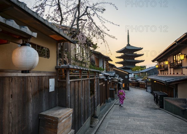 Japanese woman in kimono in an alley, Yasaka dori historic alleyway in the old town with