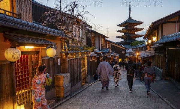 Japanese woman and men wearing kimono in an alley, Yasaka dori historic alleyway in the old town