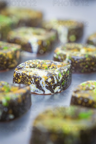 Close-up of a chocolate with a lively, colorful design, vegan chocolates production, Haselstaller