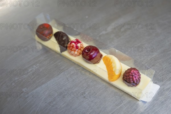 Elegant mix of chocolates in a decorative box with fruity accents, Easter production of regional