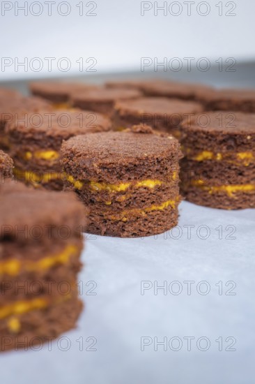 Several chocolate cakes with yellow layers on a tray, vegan cake production, Haselstaller Hof,