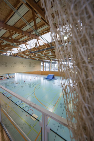 Interior view of a gym with net, playing field and impressive light, Schlehengäu Sporthalle