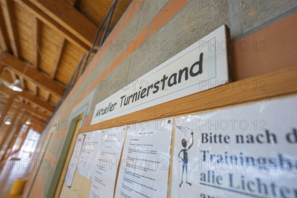 Information board with current tournament status on a brick wall, Schlehengäu Sporthalle Gechingen,