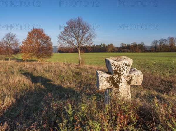 Medieval stone cross on the edge of the field in autumn, Sühnekreuz, Mordkreuz, Liebenstein,