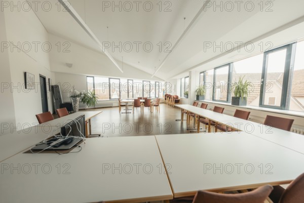 Bright meeting room with large windows and simple furniture, Gechingen Town Hall, Calw District,