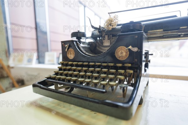 Antique typewriter in front of a window, nostalgic atmosphere, Gechingen Town Hall, Calw district,