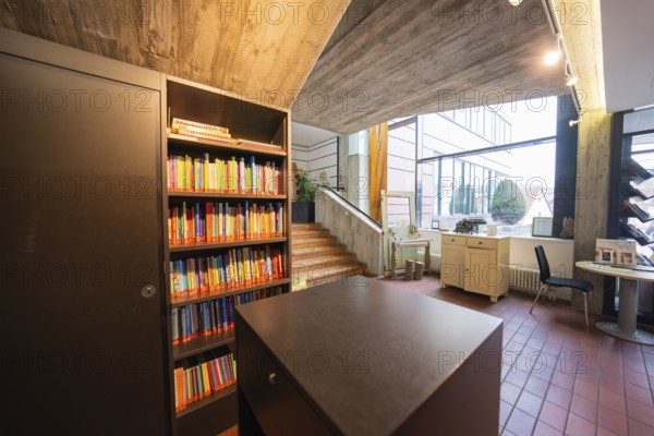 Modern interior design with bookshelves and large windows, Gechingen Town Hall, Calw district,