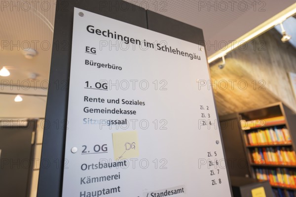 Guide in the office building with information about various offices and floors, bright atmosphere,