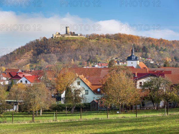 The ruins of Mühlburg and the village of Mühlberg in autumn, Burgenensemble Drei Gleichen,