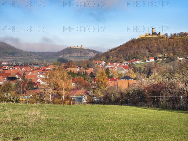 View of the village of Mühlberg and the ruins of Mühlburg and Gleichen Castle in autumn, castle