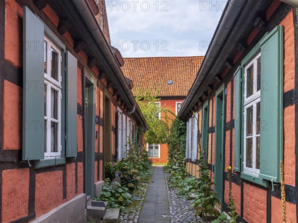 Narrow alley with half-timbered houses in the Heilgeisthospital, also Heilgeistkloster or Kloster