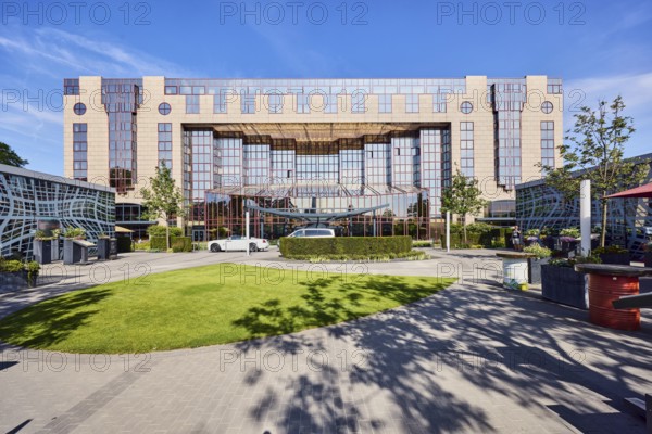 Hotel Hyatt Regency, commercial building, modern architecture, lawn, hedges, trees, blue sky,