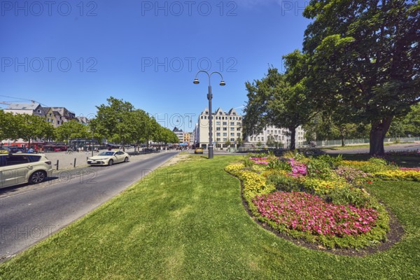 Traffic island, lawn, flower bed, trees, lantern, alleyway, taxi, taxi stand, general architecture,