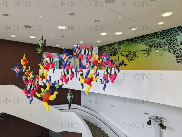 Colorful sculptures, Nanas, artist Niki de Saint Phalle, colorful figures, woman hanging in the