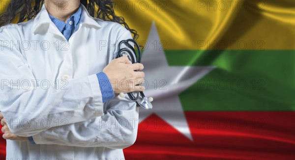 Healthcare professional with Myanmar flag background. Professional doctor holding stethoscope on
