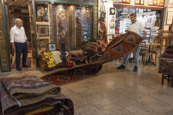 Istanbul, Turkey. June 23rd 2025. Antique carpet and rug traders doing business in the Grand