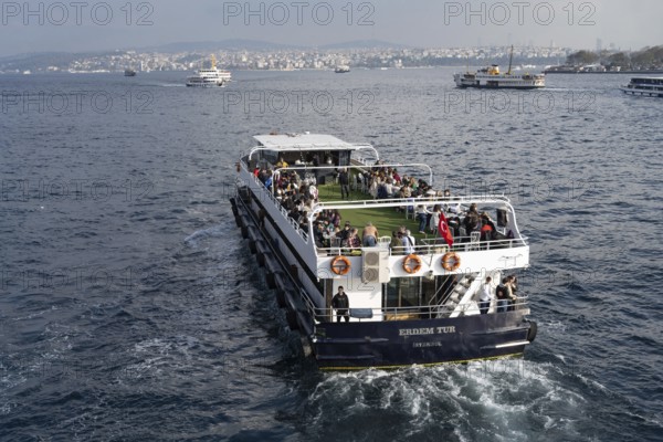 Istanbul, Turkey. December 2nd 2025. A Turkish tour boat with tourists leaves the Golden Horn and