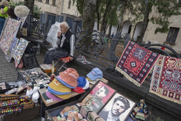 Gori, Georgia. September 9th 2025. A man selling Stalin souvenirs and memorabilia outside the