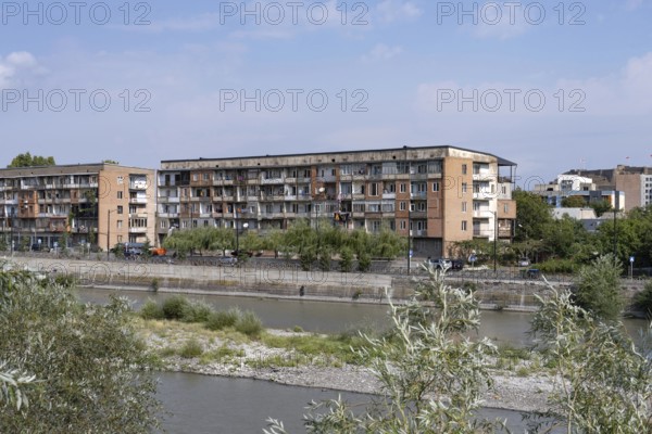 Gori, Georgia. September 9th 2025. Soviet style housing buildings beside the Kura Rive in Gori, a