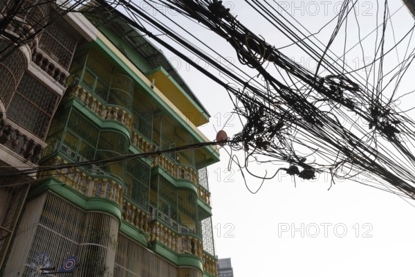 Bangkok, Thailand. March 4th 2025. A tangled mess of cables and wires used for phone and internet