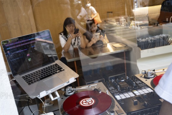 Bangkok, Thailand. March 25th 2025. A DJ deck set up inside a popular café in the trendy Talat Noi