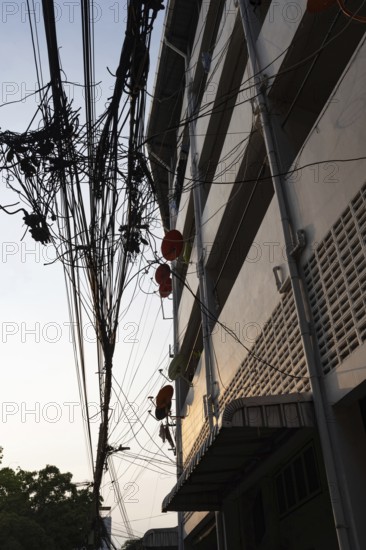 Bangkok, Thailand. March 4th 2025. A tangled mess of cables and wires used for phone and internet