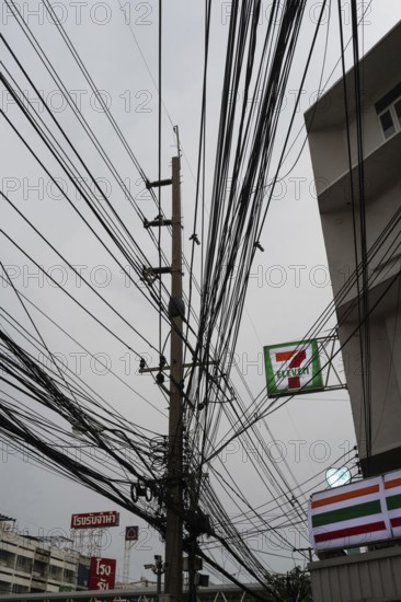 Bangkok, Thailand. March 4th 2025. A tangled mess of cables and wires used for phone and internet