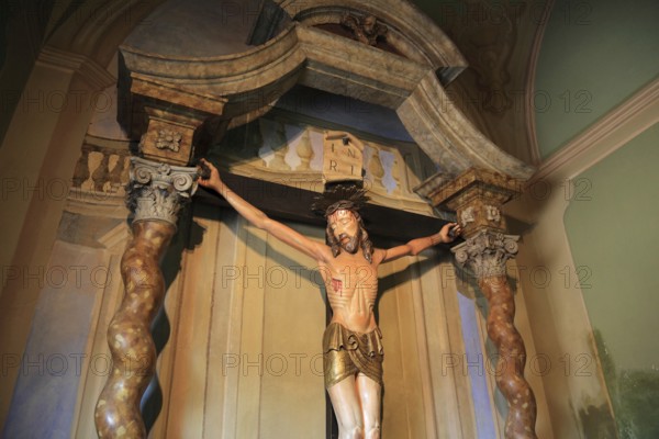 Italy, village of Brescello, cross from the movie, Don Camillo and Peppone in the church of