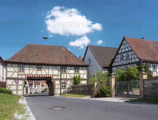 The gatehouse of Trappstadt, town hall, half-timbered house from 1728 with passage, Trappstadt,